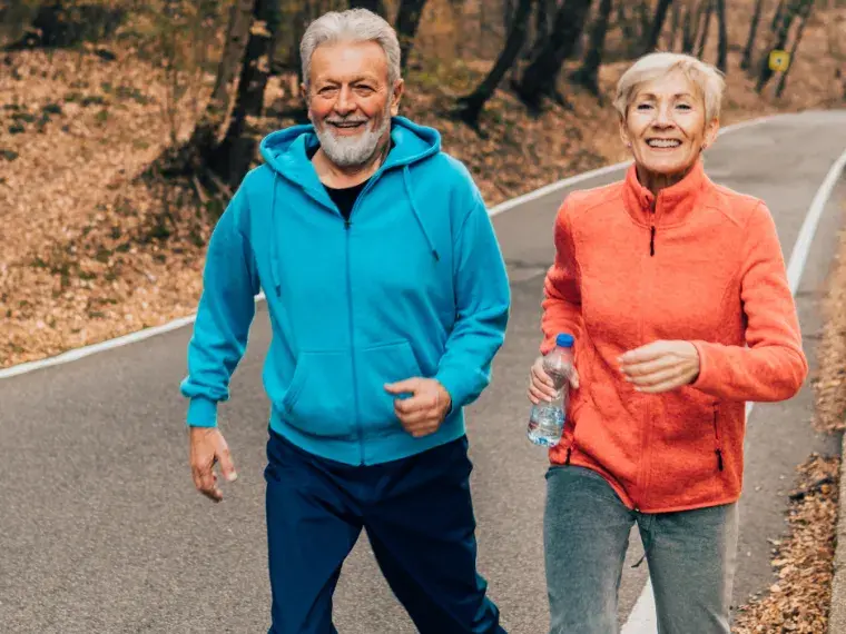 Couple running in fall