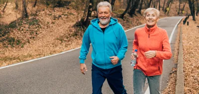 Couple running in fall