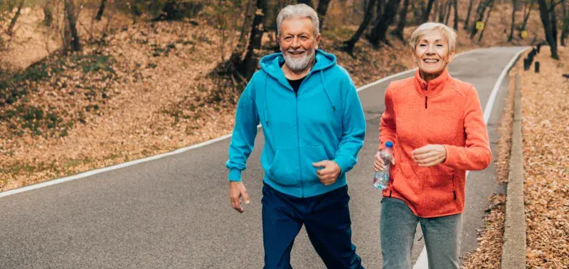 Couple running in fall