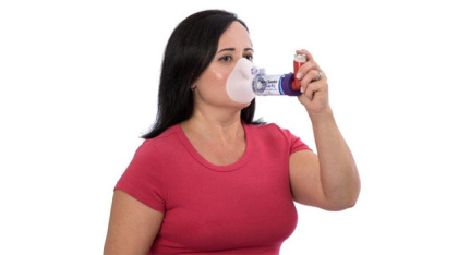 AeroChamber Plus Flow Vu Chamber purple adult small mask in use by woman