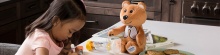 child with teddy bear and inhaler devices